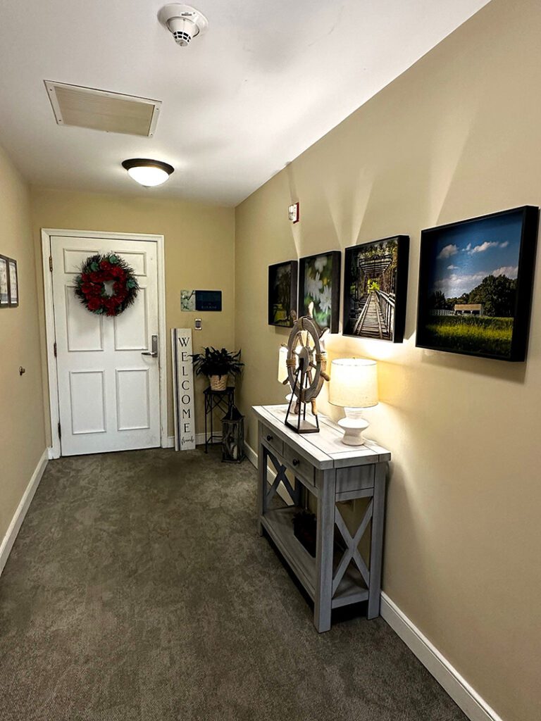 warm hallway with framed artwork