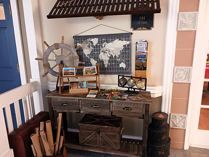 exploration display including globes, maps and brochures