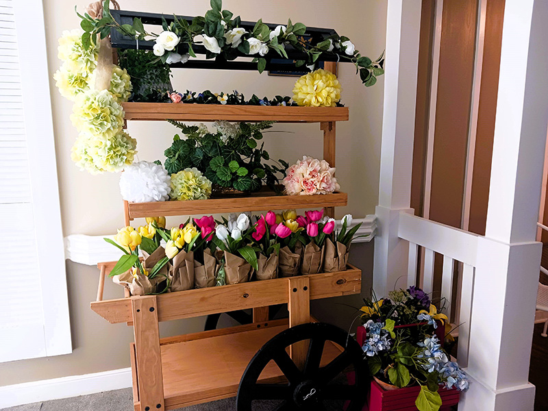 wooden cart filled with flowers