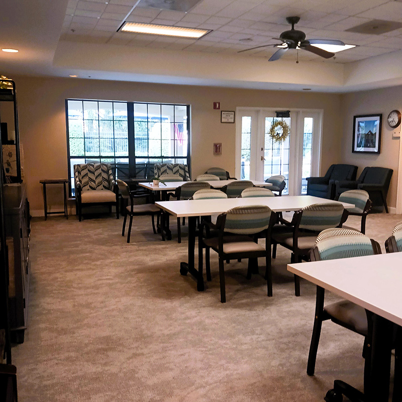 warm community room with tables and seating