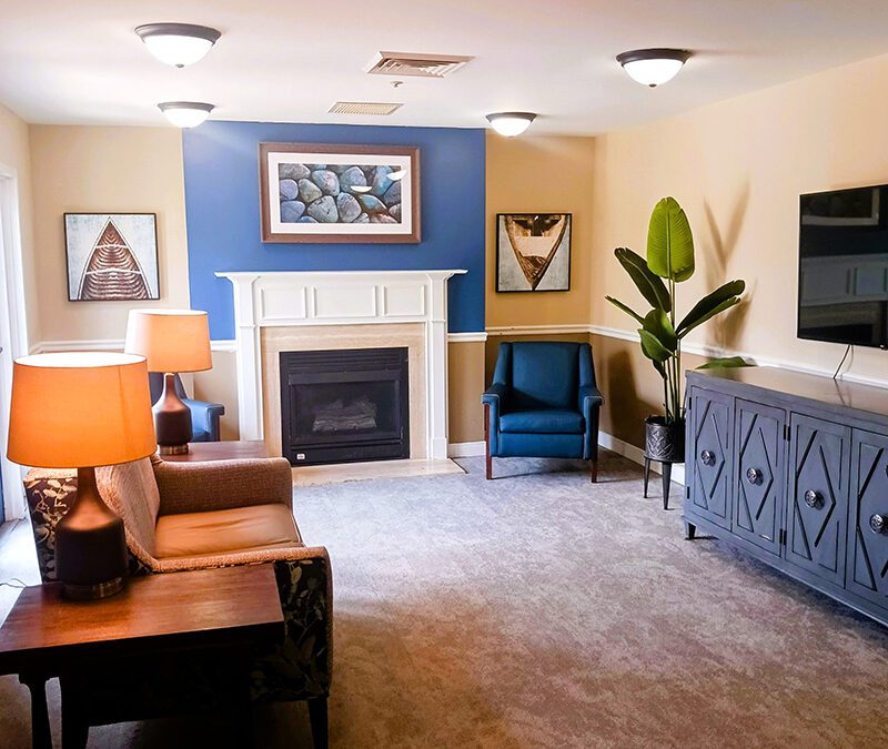 community room with fireplace and artwork