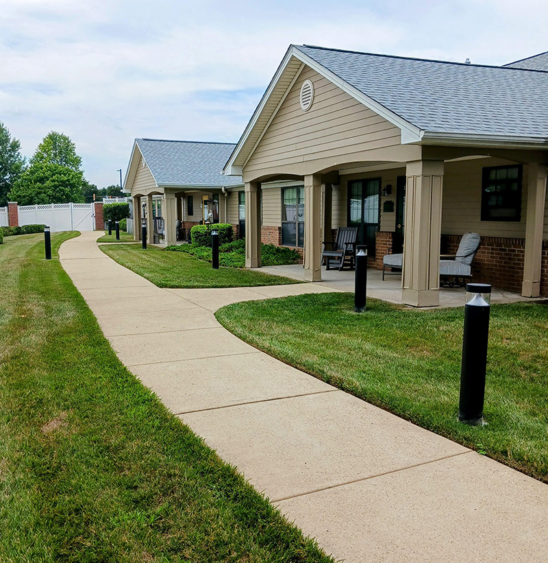 neighboring front porches along a sidewalk