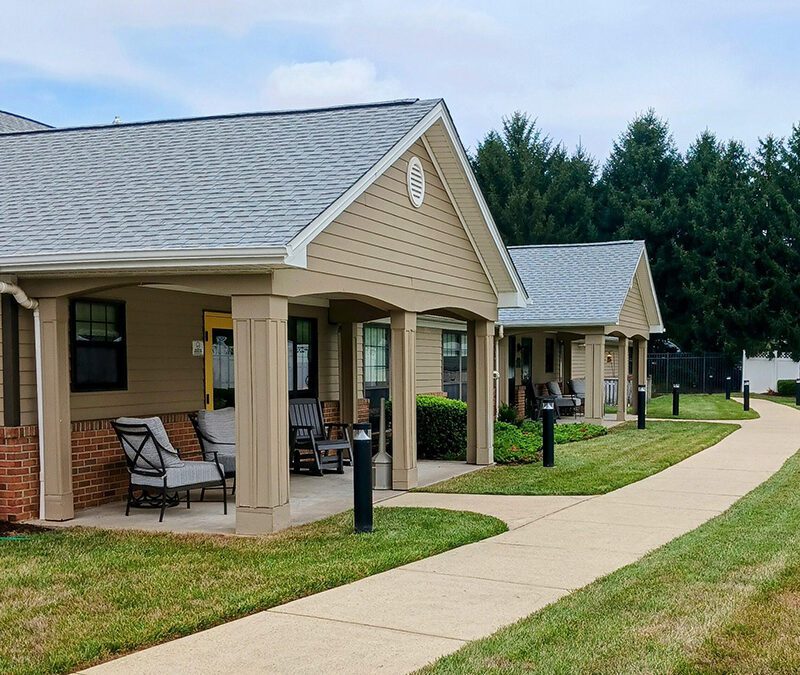front porch with rocking chair and love seat