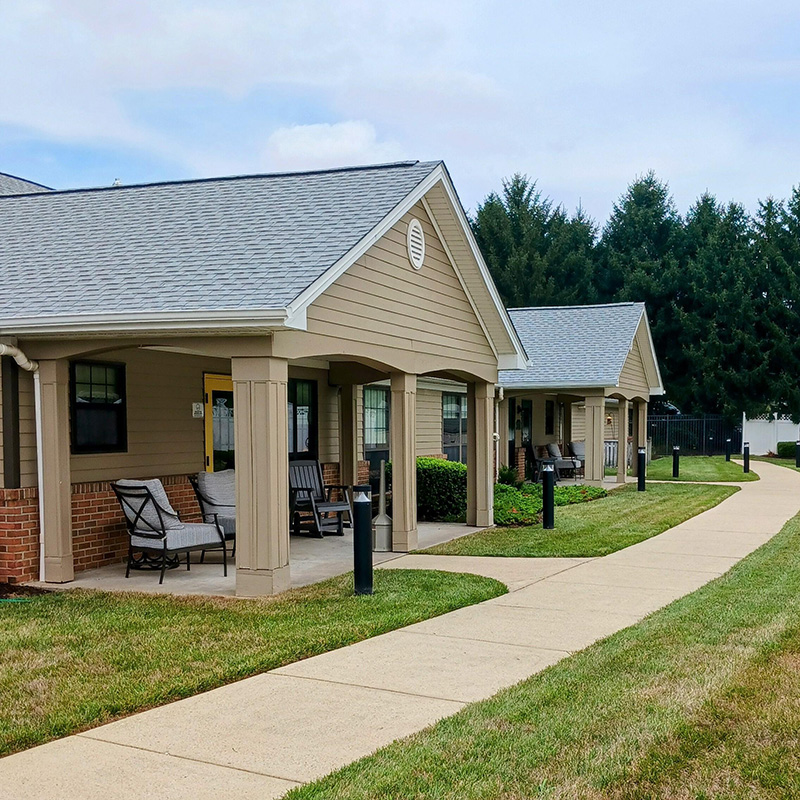 front porch with rocking chair and love seat
