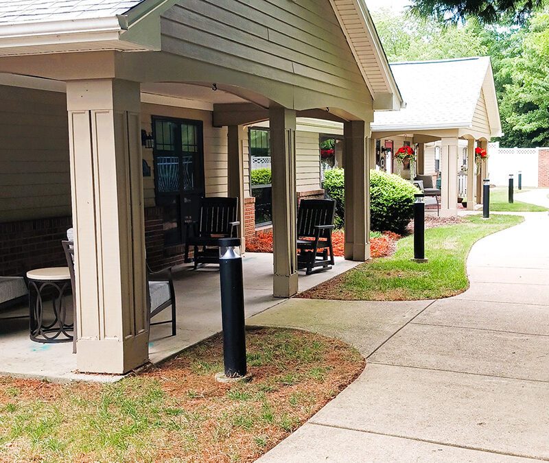 neighboring front porches with cozy furniture